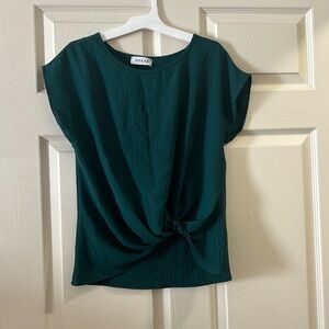 Selling a nice dark green blouse. The brand is Gilli, and it’s a size small